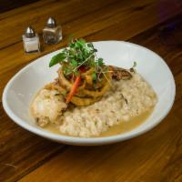 Lobster Risotto · Butter poached lobster meat, wild mushroom, risotto & crispy onion.