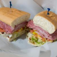 Deli Sub. · Ham, Salami, Swiss ＆ American Cheese.
Served on a Toasted Bun, with Lettuce, Tomatoes, and m...