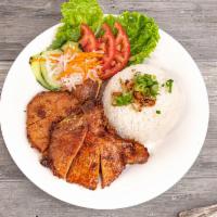 Com Tam Suon Nuong · BBQ pork chops over broken rice.