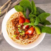 Bun Oc · Vermicelli noodle soup with conch, tomato, fresh herbs, tofu, and a lime wedge