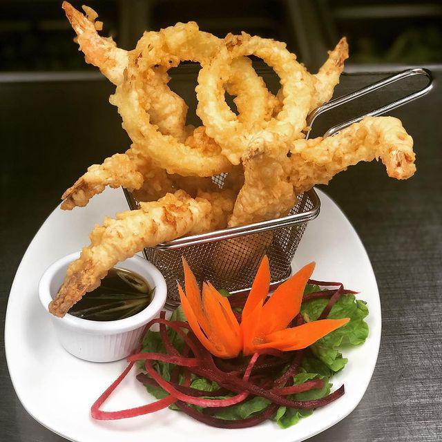Tempura Shrimp · 6 pieces. Served with onion rings and sweet chili sauce.