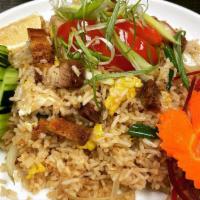 Thai Fried Rice · Our house fried rice with choice of meat, yellow and green onion, tomatoes, egg, and cucumbe...