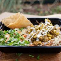 Poblano Chicken Bowl · Tender chicken breast chunks and corn bits marinated and cooked in traditional Poblano peppe...
