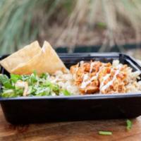 Chicken Tinga Bowl · Savory adobo marinated chicken breast over a hearty portion of white rice with your choice o...