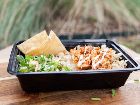 Chicken Tinga Bowl · Savory adobo marinated chicken breast over a hearty portion of white rice with your choice of toppings: salad, cooked onions, cilantro, fresh cotija cheese, Mexican cream, and tortilla chips.
