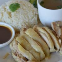 KAO MUN GAI · Poached chicken served with garlic ginger-flavored rice, spicy soybean sauce, fresh cucumber...