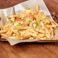 Lobster Cheesy Fries · Chunks of lobster meat served over fries and topped with our house cheesy sauce. Topped with...