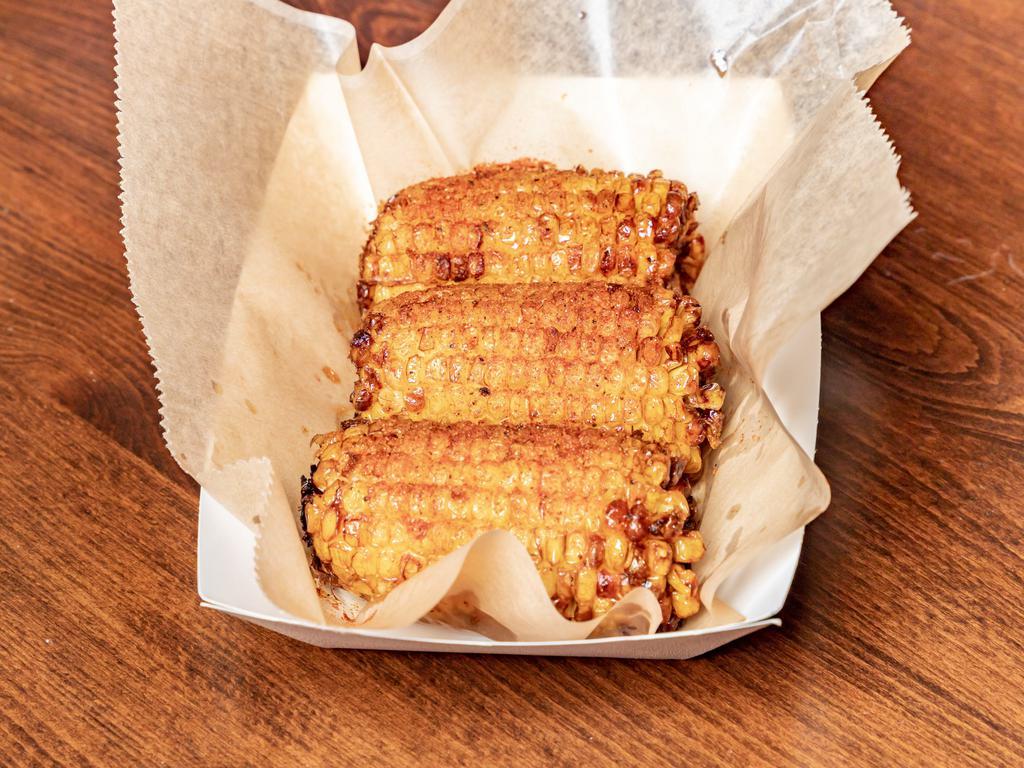 Fried Corn · Fried corn on the cob topped with our house Cajun spices. Finally, a corn that won’t stick to your teeth!