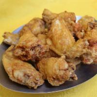 Fried Chicken Wings · 10 pieces. Cooked wing of a chicken coated in sauce or seasoning.
