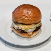 Sausage, Egg and Cheese Sandwich · Made on a Macrina brioche roll with a slow poached egg and white cheddar.