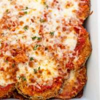 Eggplant Parmigiana · Breaded and fried to order. Eggplant topped with mozzarella cheese served with tomato or mar...