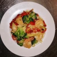 Chicken Del Rio · Strips of chicken sauteed with baby shrimp, chopped spinach, onions, roasted red peppers in ...