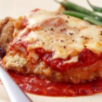 Veal Parmigiana · Italian style breaded veal cutlet baked in tomato sauce and topped with mozzarella cheese an...