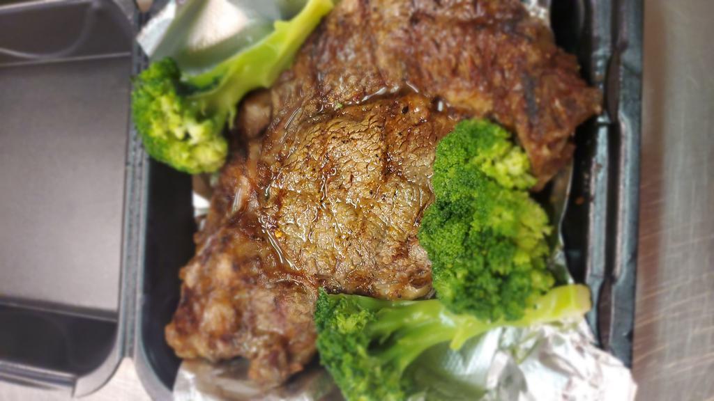 18 oz Delmonico · Juicy steak topped with sauteed mushrooms served alongside mashed potatoes and fresh broccoli