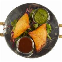 Cheese Samosa · 2 turnovers stuffed with mozzarella cheese and spices.