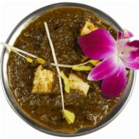 Saag Curry · Puree of fresh spinach cooked with ginger, garlic and roasted cumin. Served with rice. Vegan...