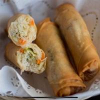 Spring Rolls · Freshly made fried spring roll. rice noodle, cabbage, and carrots wrapped in rice paper. Ser...