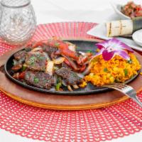 Fajitas · Sauteed marinated hanger steak, chicken or shrimp, bell peppers and onions, yellow rice, pic...