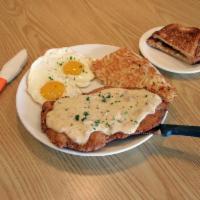 King CFS Combo · Hand breaded chicken fried steak, sausage gravy, two eggs, choice of side and toast.