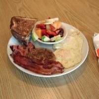 Meat Lover's Breakfast Combo · 2 eggs, bacon, ham and sausage, choice of side and toast.