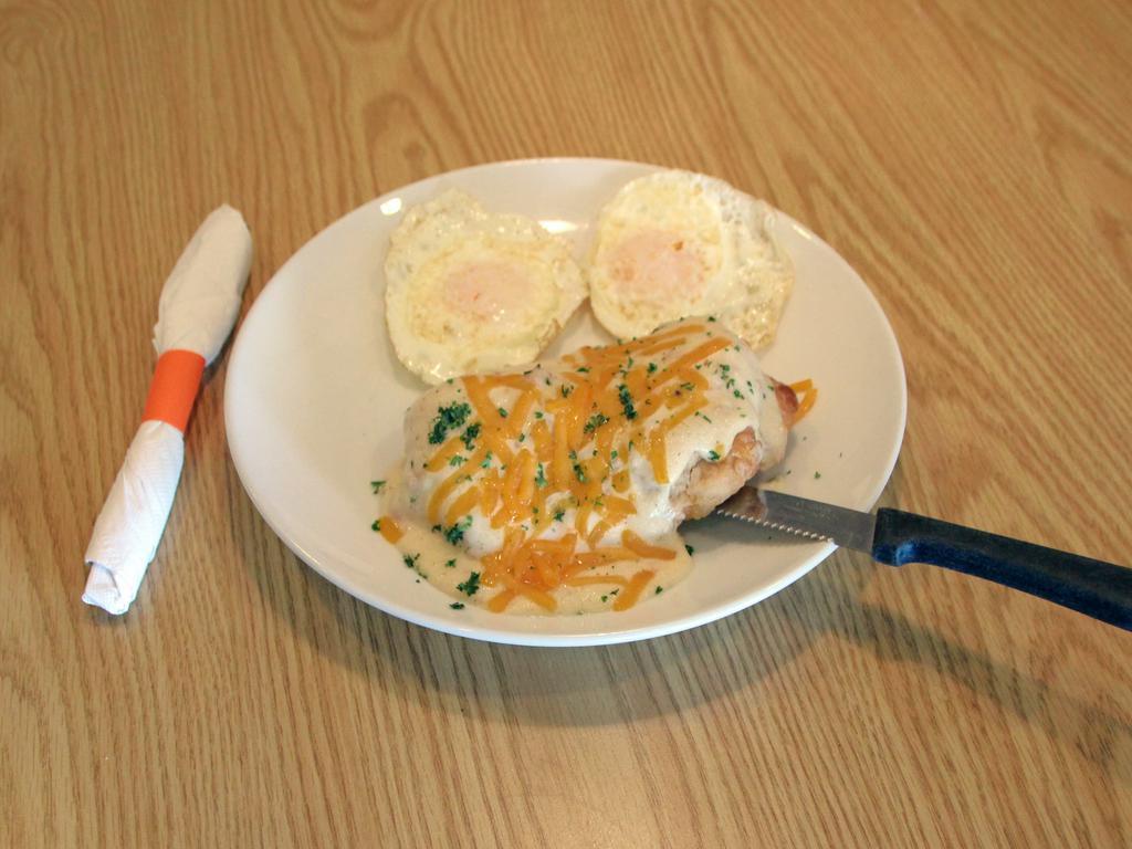 Stuffed Biscuit and Gravy Specialty · Stuffed biscuit and gravy a giant fresh-baked biscuit stuffed with sausage, peppers, onions and cheese. Topped with gravy, served with 2 eggs. (Item cannot be customized, the loaves are pre-baked.)