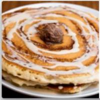 Cinnamon Roll Pancakes · 2 stack of our famous pancakes baked with a cinnamon swirl sauce, and topped with maple glaz...