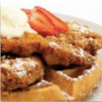 Chicken & Waffles · Our Hand breaded fried Chicken on top of a Golden Brown Waffle topped with honey butter.