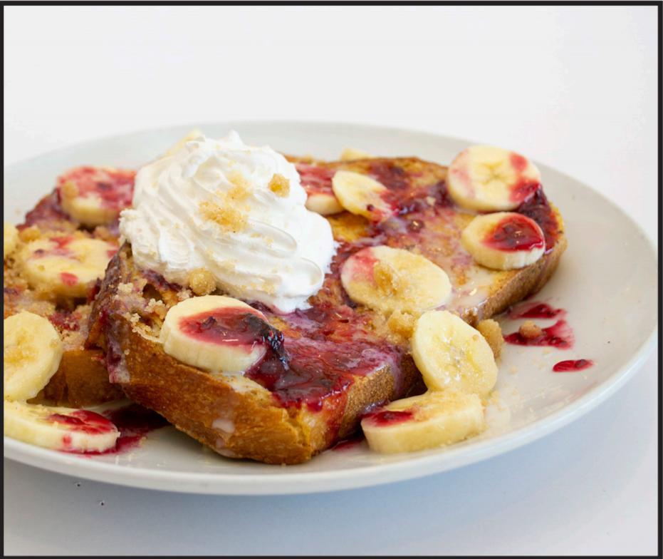 Banana Berry French Toast · Our Thick Griddled French Toast topped with bananas, homemade berry sauce, tres leches, streusel crumbles & whipped cream. 