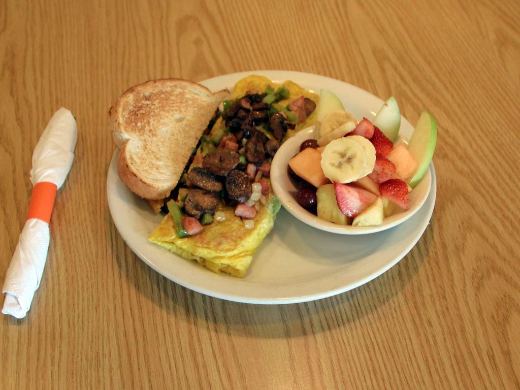 Denver Omelette · Ham, onions, green peppers, mushrooms and Monterey Jack.