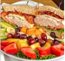 Southwest Turkey Club Sandwich · Oven-roasted turkey stacked high on whole grain wheat. Bacon, Jack cheese, lettuce, tomato and chipotle mayo.