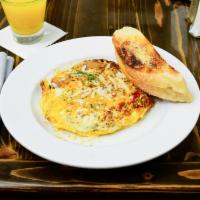  Meat Lovers Frittata · Our version of an open omelet! 3 eggs, with crumbled breakfast sausage, diced bacon, diced h...