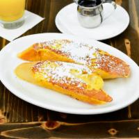 Thick Cut French Toast · Made with fresh local Martiscello's French bread, soaked in our vanilla custard batter. Dust...