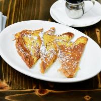 Gluten-Free French Toast · Made with Udi’s gluten free white bread, soaked our housemade vanilla custard batter. Dusted...