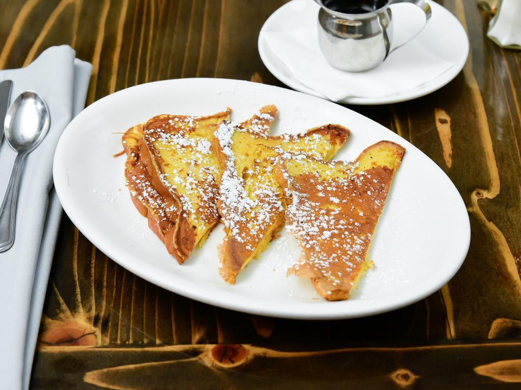 Gluten-Free French Toast · Made with Udi’s gluten free white bread, soaked our housemade vanilla custard batter. Dusted with powdered sugar on top. Served with regular syrup & butter packets. 