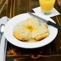 Biscuits and Gravy · Our housemade cheddar cheese buttermilk biscuits served with our housemade British herb grav...