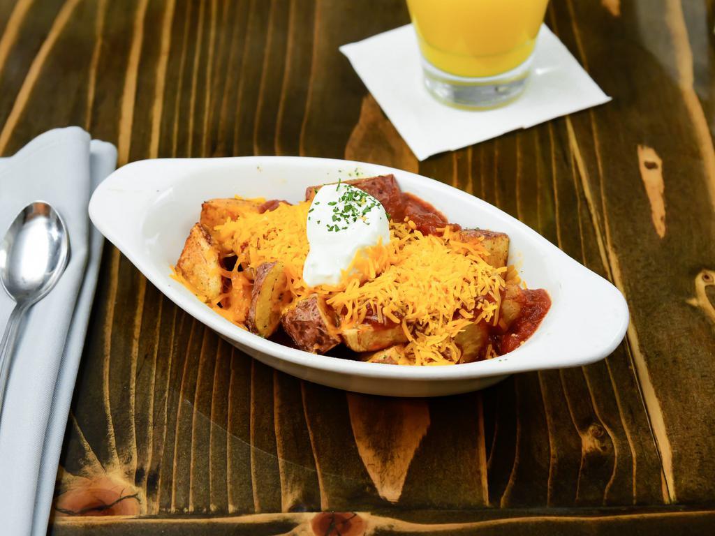 Queen's Way · Tossed in ranch seasoning, topped with salsa, cheddar cheese and sour cream. Gluten-free.