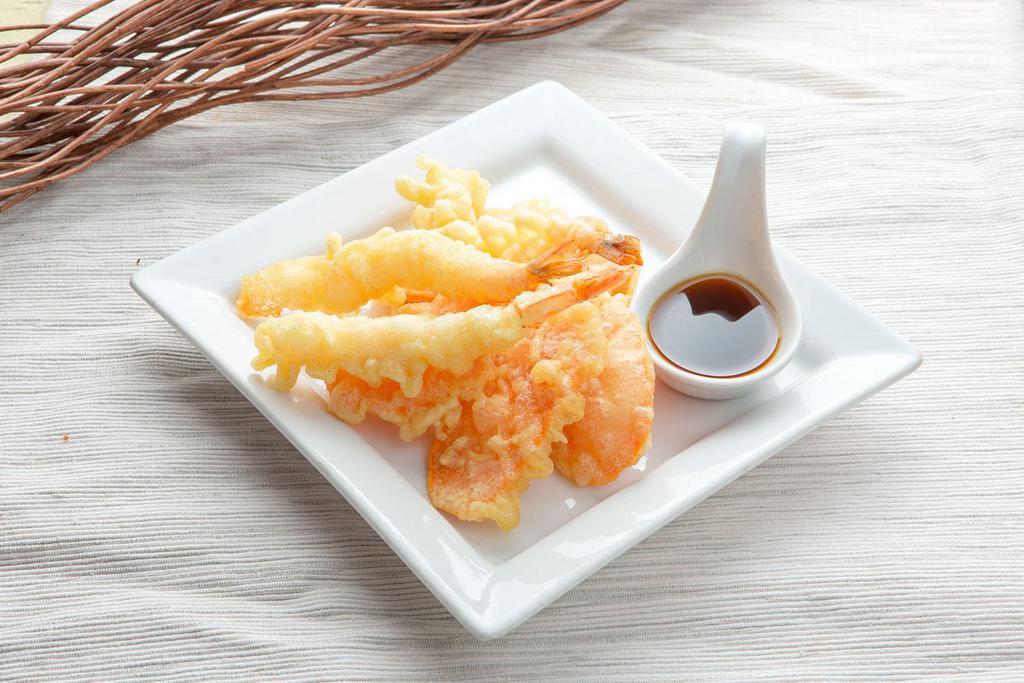 Tempura Prawn · 3 pieces. Deep-fried battered prawn with crispy sweet potato served with tempura sauce.