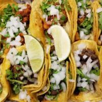 Taco · Street style corn tortilla taco with onion, cilantro, lime and your choice of meat.