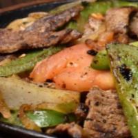 Fajitas Mixtas · Combination of chicken and steak with grilled onions, bell pepper, and tomato.