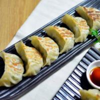 A2. Gyoza · 6 pieces. Japanese deep fried or steamed pork dumplings with sweet soy sauce.