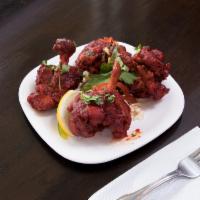 Chicken Lollipops · Chicken wings marinated in spices coated in zesty batter and deep fried.