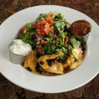 Nachos ·  House-made chips, queso, black beans, and pico de gallo, with sour cream and choice of mild...