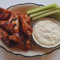 Wings · Tossed with your choice of Cajun dry rub, buffalo sauce, or sweet & spicy bbq sauce, then ki...