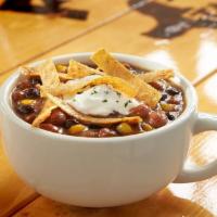 Baja Tortilla Soup · A delicious medley of vegetables and hearty beans in a flavorful vegetable broth topped with...
