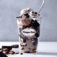 Rocky Road Dazzler Sundae · Rocky road ice cream layered with hot fudge and chocolate cookie pieces topped with whipped ...