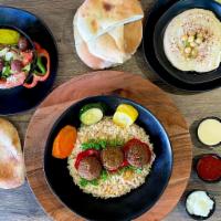 Falafel Plate · Served with choice of rice, salad, and dip & pita bread.