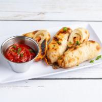 Pepperoni Pizza Rolls · Pepperoni, mozzarella and provolone. Served with a side of marinara sauce or ranch.