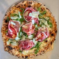 Bufalina Pizza · White pizza with grape tomatoes, basil, mozzarella, arugula, prosciutto and shaved Parmigian...