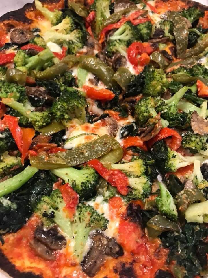Vegetale Pizza · Sauteed broccoli and spinach with garlic and extra virgin olive oil, mushrooms, roasted peppers & mozzarella. Choose tomato and basil sauce or extra virgin olive oil and light garlic.