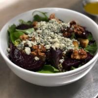 Organic Baby Green Salad · With crumbled Gorgonzola, caramelized walnuts, wood-fired roasted beets and herb garlic crou...